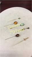 Selection of antique gemstone lapel or hat stick