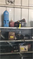 3 Shelfs Of Misc Iron, Gas Cans Oil Pan Etc