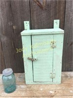 Small green paint hanging cupboard
