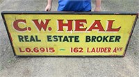 Huge painted wood double sided real estate sign.