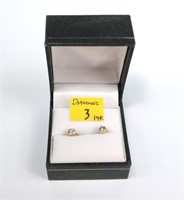 Pair of 14K gold diamond stud earrings,