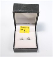Pair of 14K gold diamond stud earrings,