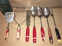 red wooden handle kitchen utensils