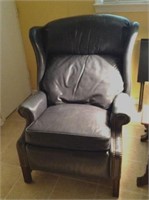 Navy Leather wing back chair, arm is faded