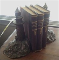 Pair Iron lighthouse bookends, 3 books
