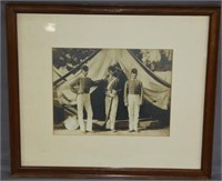 photo of 3 soldiers in frame, one holding musket,