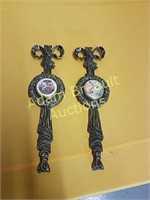 2 decorative 15 inch cast iron wall hangings