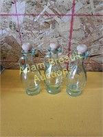 Three 7 inch glass cruet bottles