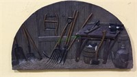 Molded farm workshop plaque with antique tools,