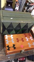 Two decorative boxes, green one with Rubbermaid