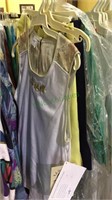Group of 5  tennis playing tops & skirts, size