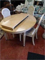 Yellow marble like d/r table with three chairs