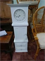 White clock with storage and draws