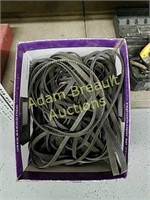 Large box of assorted belts and hoses