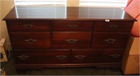 NINE DRAWER FOOTED DRESSER