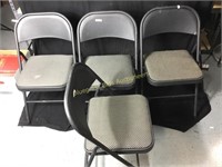 Four folding chairs used