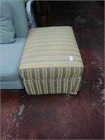 Square yellow ottoman with blue stripped