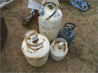 Four expired propane tanks c/w some propane