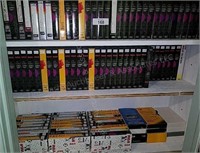 3 shelves of VHS home taped tv shows