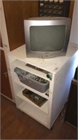White rolling cabinet, & contents including TV