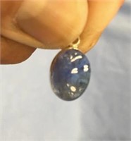 Small blue stone set in sterling silver with sterl