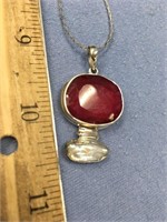 Ruby and baroque pearl pendent on a sterling silve