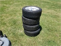 L- 4 FORD RIMS AND TIRES.