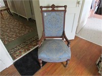 UPHOLSTERED CHAIR NOTE FRONT WOODEN WHEELS