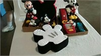 Two boxes of Mickey Mouse pillows, phones,