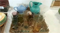 Two boxes of colored glassware, pitcher, teapot