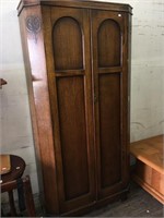 Gorgeous wooden armoire with cropped corners in im