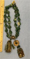 Necklace of round and flat jade beaded necklace wi