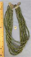 Multi strand jade bead necklace with 2 attached ho