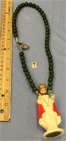 Jade necklace with an attached Infant of Prague st