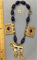 Necklace made of large oval shaped lapis beads, wi