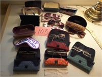 Various eye glasses, sunglasses and cases