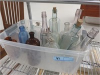 Tub of glass bottles