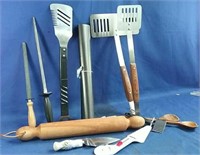 Kitchen/BBQ utensils including a wooden