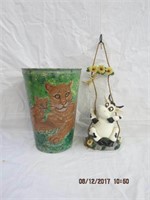 13 X 9" painted trash can and a hanging cow