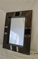 Faux leather framed hanging beveled mirror