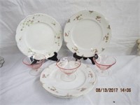 4 flower decorated plates made in England and