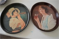 Two Coca-Cola oval trays