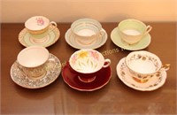 SIX ENGLISH CUPS AND SAUCERS