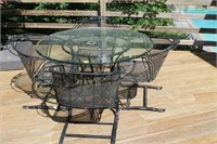 WROUGHT IRON TABLE WITH GLASS TOP AND 4 CHAIRS