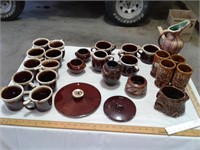 all of the brown ware in the photo