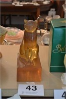 Lucite amber 11" cat sitting on base