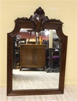 Cartouche and Bell Flower Crowned Oak Mirror.