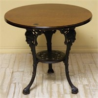 Figural Accented Cast Iron Pub Table with Oak Top.