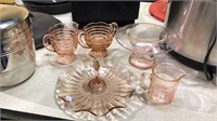 Five pieces of pink Depression glass including