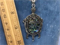 An abalone turtle pendant with marcasite with movi
